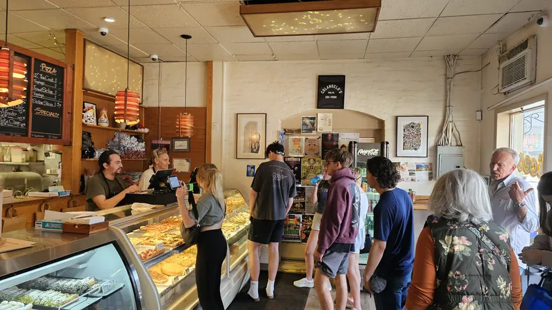 Strip District: a packed counter on a Sunday morning